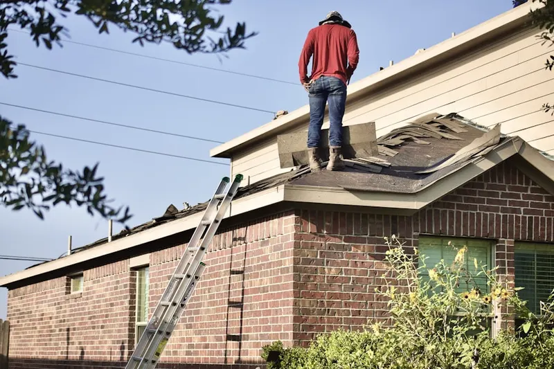 Professional roofer working on a residential roof in Donwtown Lee's Summit